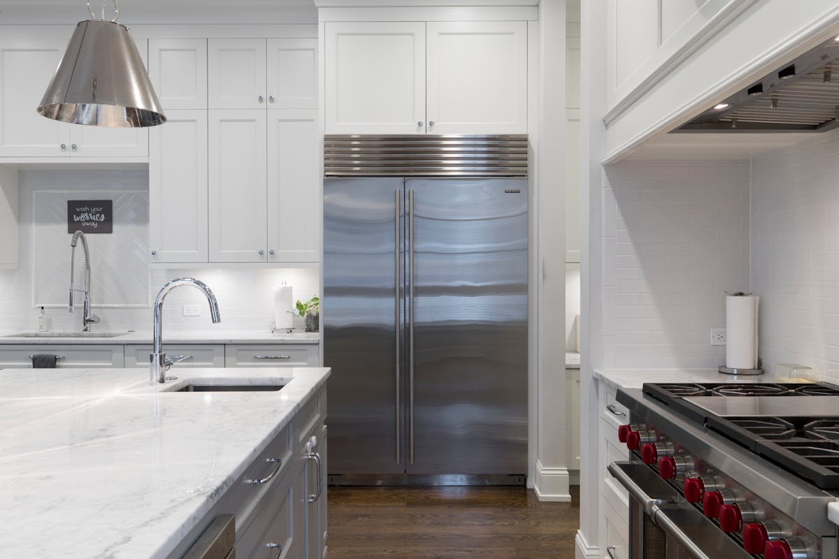 Stainless-steel built-in side-by-side refrigerator in a modern Toronto kitchen
