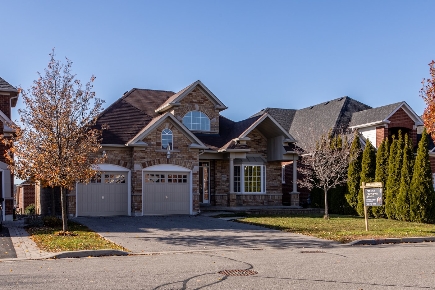 Suburban Toronto home with stone facade and double garage on a residential street